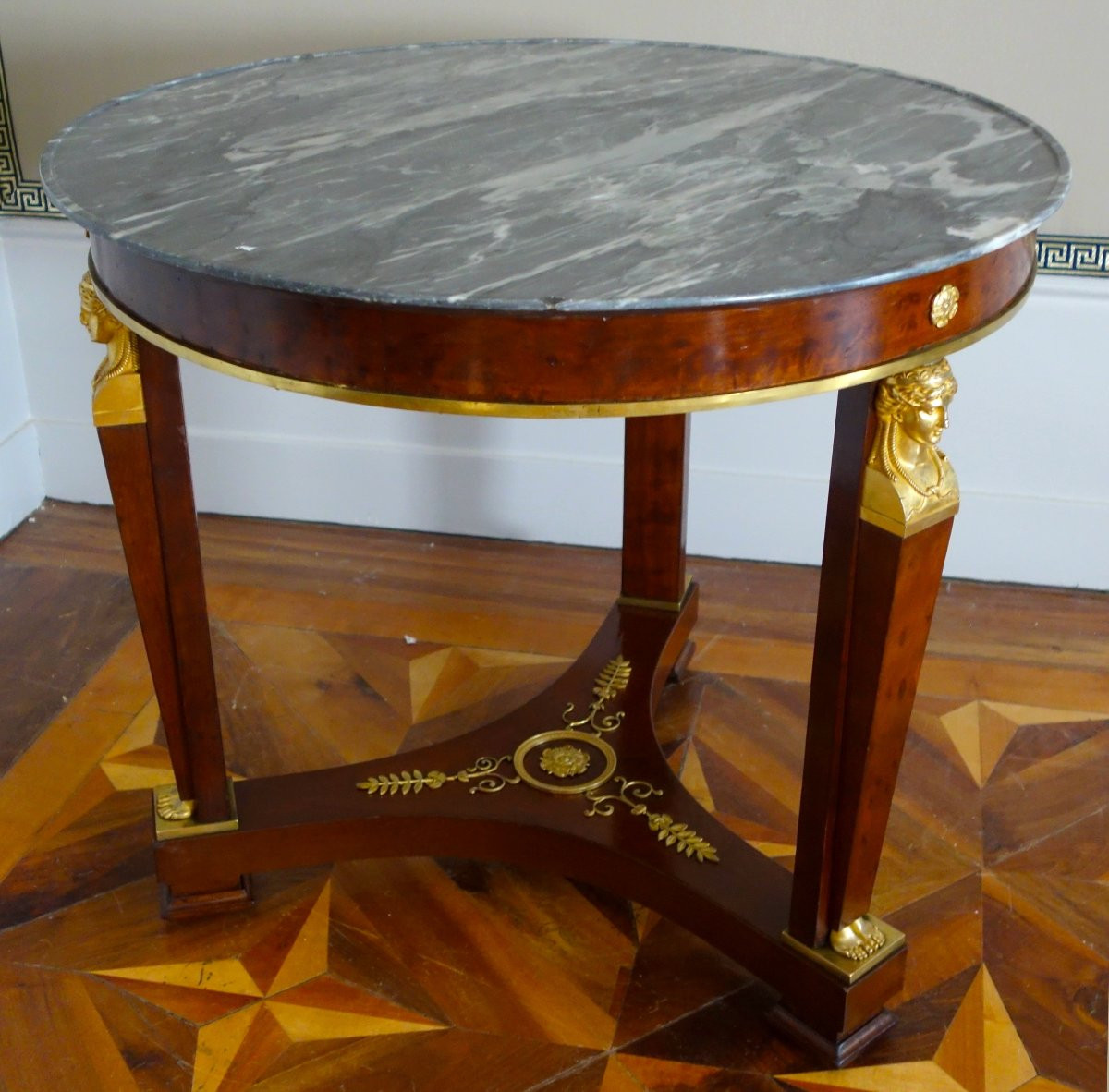 A Mahogany Pedestal Table From The Consulate/empire Period, With Rich Gilt Bronze Mounts And A Turquin Marble Top.-photo-2