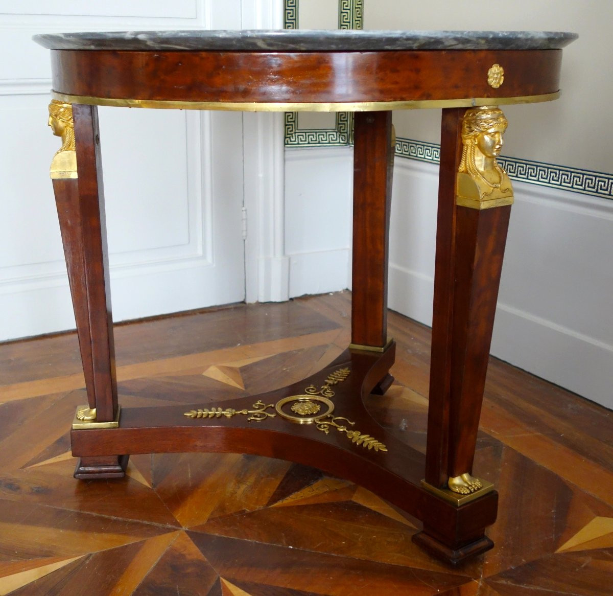 A Mahogany Pedestal Table From The Consulate/empire Period, With Rich Gilt Bronze Mounts And A Turquin Marble Top.-photo-1