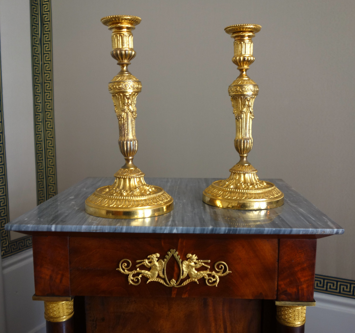 Pair Of Louis XVI Style Candlesticks In Chased And Gilded Bronze