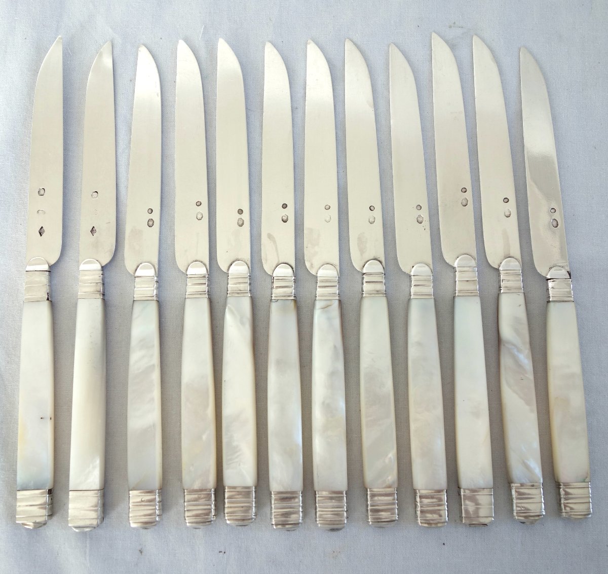 Set Of 12 Fruit Knives, With Solid Silver Blades, Mother-of-pearl Handles, And The “coq Et Vieillard” Hallmark