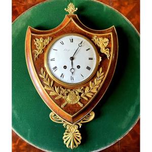 Empire Cartel Clock In Crest, Thuja Burl And Gilt Bronze, By Raguet Early 19th Century