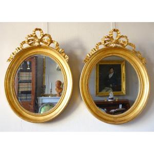 Pair Of Large Oval Gilded Wood And Mercury Glass Mirrors, Louis XVI Style, Circa 1860