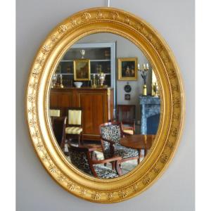 Grand miroir ovale d'époque Empire en bois doré feuille d'or - 78cm x 65,3cm
