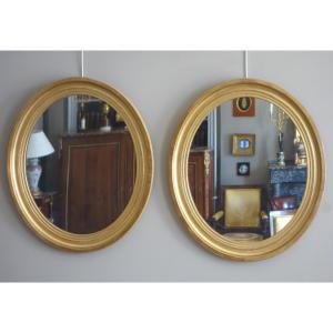 Pair Of Large Oval Mirrors In Gilded Wood And Mercury Glass In The Louis XVI Style