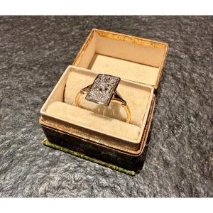 bague or jaune et platine chaton orné d'un diamant 