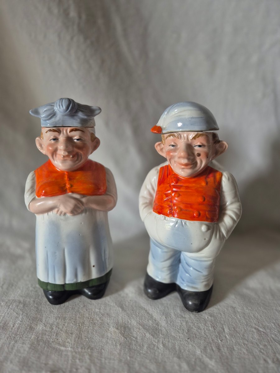 2 Anthropomorphic Bottles Depicting A Couple Of Simple-looking Farmers