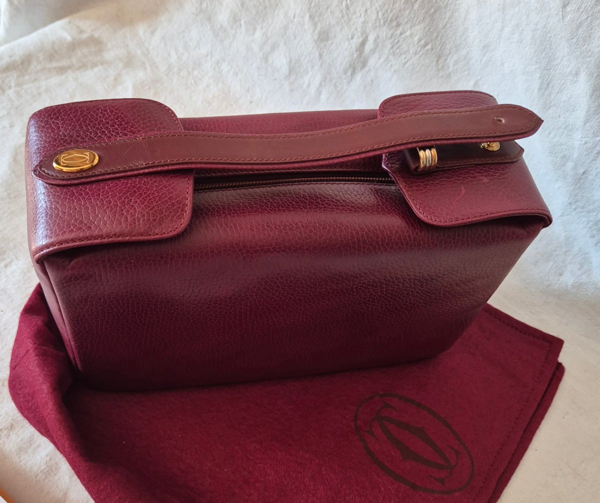 Cartier "must" Toiletry Bag In Bordeaux Leather With Trinity Ring Motif, Circa 1990