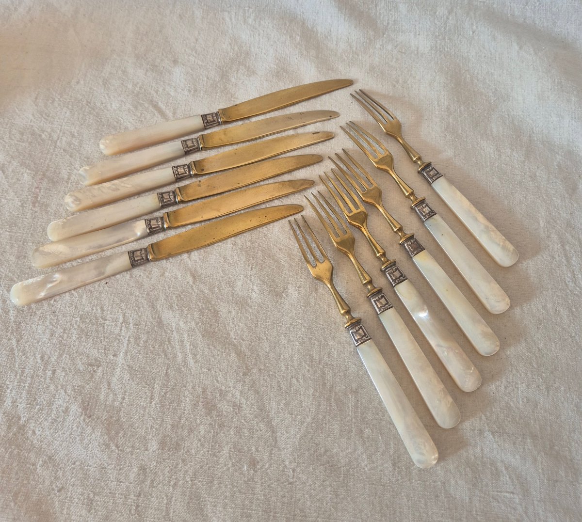 A Set Of Six Knives And Six Forks Made Of Mother-of-pearl, Silver, And Gilded Metal. 