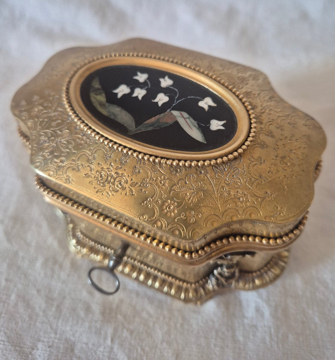 A Precious Gilded Bronze Box By Tahan, With A Flowing Design And A Pietra Dura Medallion 