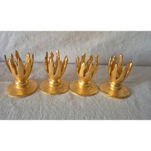 Ensemble de quatre petits bougeoirs de table signés Édouard Rambaud en bronze doré 