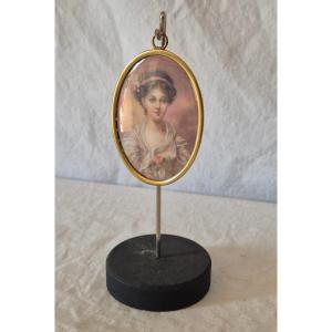 Miniature ovale de jeune fille à la rose peinte sur ivoire fin XIXème 