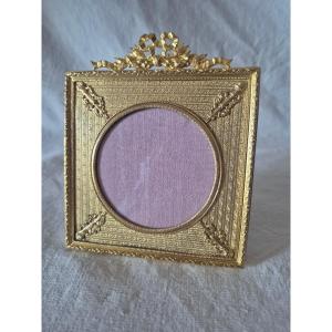 Square, Gilded Bronze Picture Frame With A Round Opening And A Mat, Featuring 19th-century Embellishments