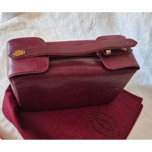 Cartier "must" Toiletry Bag In Bordeaux Leather With Trinity Ring Motif, Circa 1990