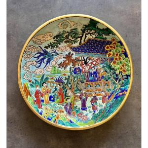Grand plat creux en émaux de Longwy, L'oiseau bleu, décor chinois de Maurice Paul Chevallier