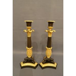 Pair Of Restoration Candlesticks In Gilded And Patinated Bronze