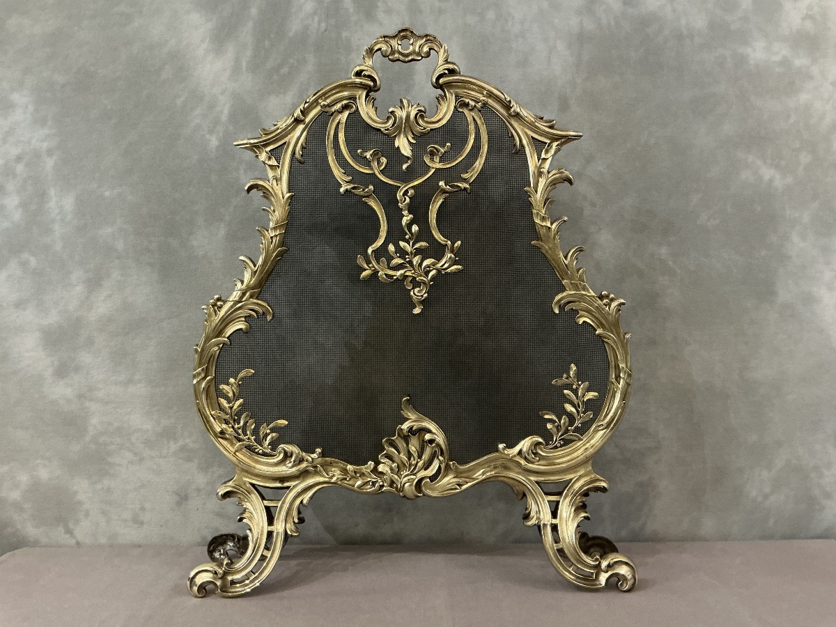 Écran de cheminée en bronze poli d’époque 19 ème de style Louis XV 