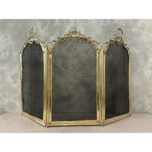 Pare feu de cheminée ancien en bronze et laiton d’époque 19 ème de style Louis XVI 