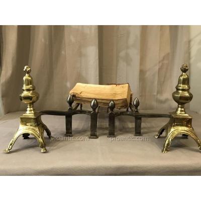 Pair Of Louis XIV Andirons In Iron And Polished Brass.