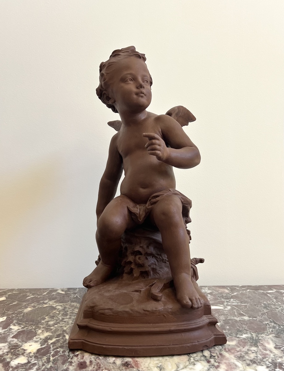Sculpture de Cupidon en terre cuite signe de  par H. Weigel 