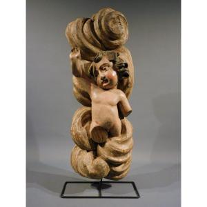 Putto en bois sculpté sur un nuage, XVIIIe siècle