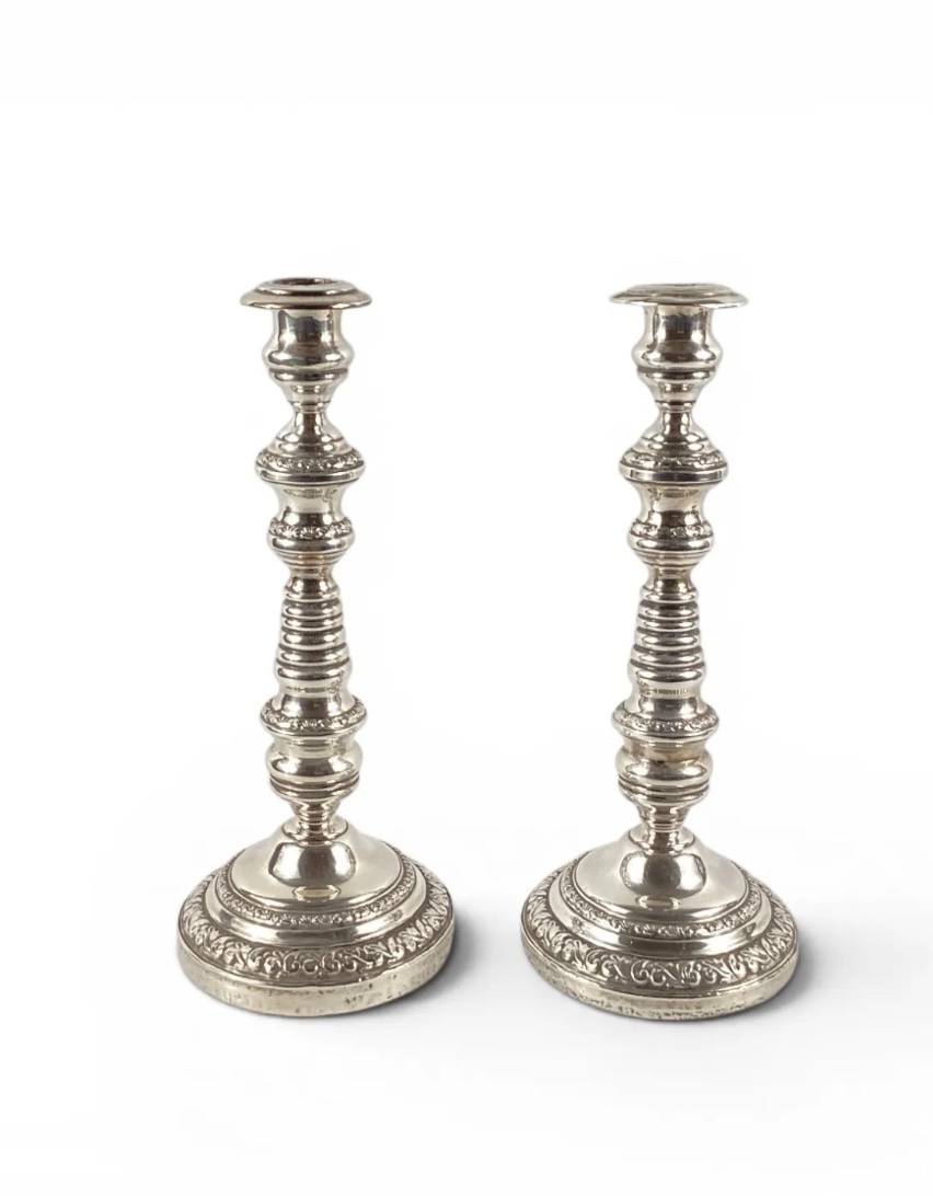 Pair Of Silver-plated Metal Candlesticks, Weighted, With Fluted Shafts And Decorated With Floral Friezes