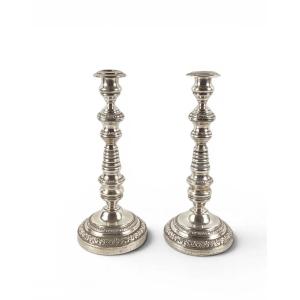 Pair Of Silver-plated Metal Candlesticks, Weighted, With Fluted Shafts And Decorated With Floral Friezes