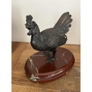 Poule en Bronze sur un socle de marbre rouge