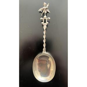 Silver Spoon Decorated With A Putto Holding A Dolphin