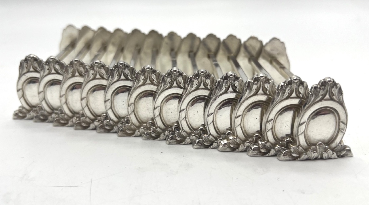 12 porte couteaux en argent massif par Sanoner