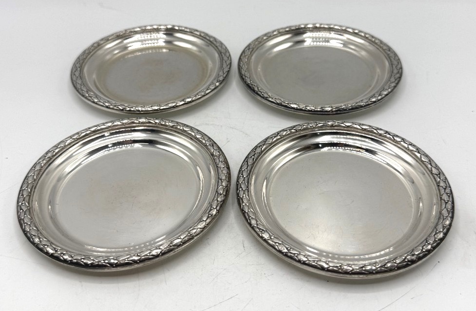 Suite de 4 dessous de bouteille en argent massif par Boin Georges et Henry/Boin Taburet