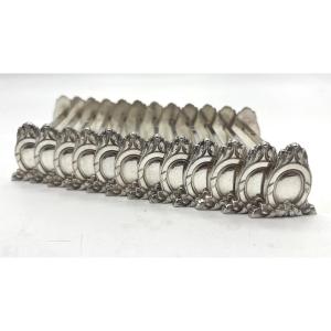 12 porte couteaux en argent massif par Sanoner