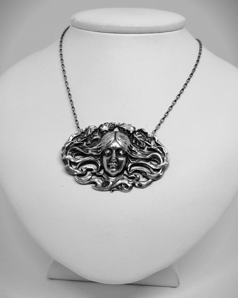 Typical Art Nouveau Necklace, Signed, With Face And Wavy Hair.