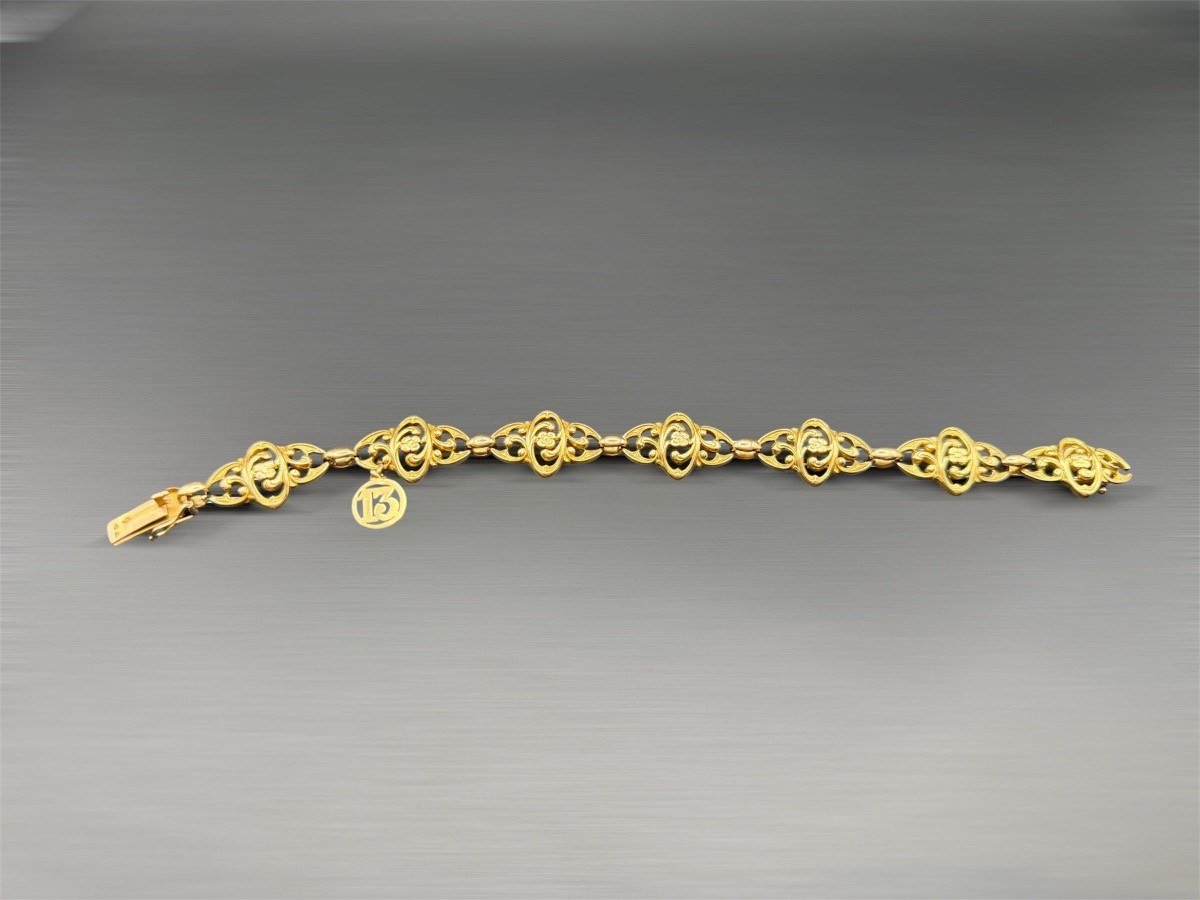 Bracelet Art Nouveau en or jaune 18 carats, à décor floral ajouré.-photo-2
