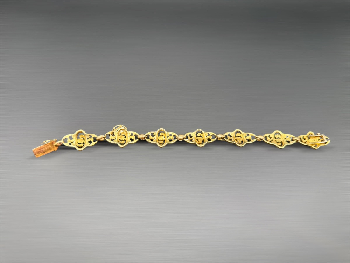 Bracelet Art Nouveau en or jaune 18 carats, à décor floral ajouré.-photo-3