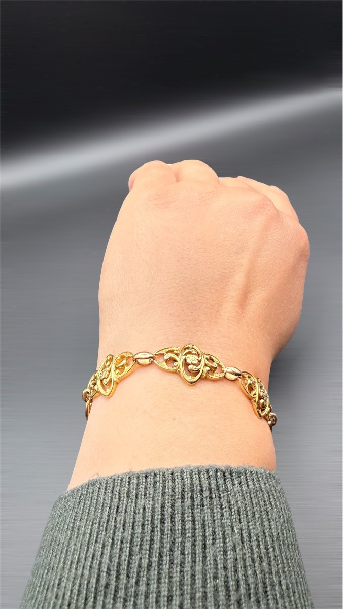 Bracelet Art Nouveau en or jaune 18 carats, à décor floral ajouré.-photo-4
