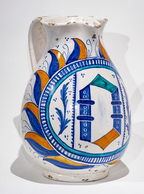 Italy 18th -19th Century - White Majolica Jug Decorated With Blue And Orange Coat Of Arms.