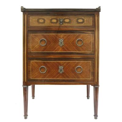 A Small Chest Of Drawers In The Louis XVI Style