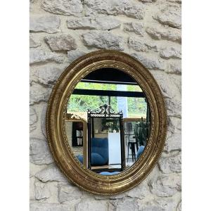 Miroir ancien ovale doré à la feuille d’or décors géométrique, 