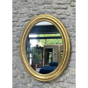 Miroir ovale 83,5/65cm doré à la feuille d’or décor floral, glace antiquité fin 19ème début 20