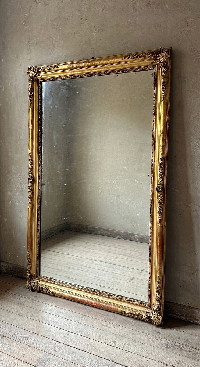 19th Century French Mirror, Crafted In Finely Carved Wood And gilded With Gold And Gold Leaf.