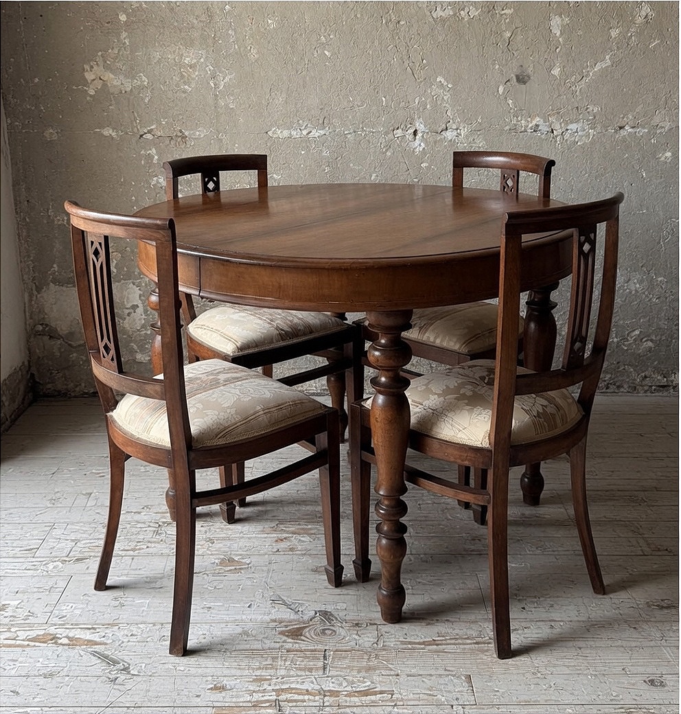 Extendable Round Table With Original Extension Leaves And Four Matching Chairs.