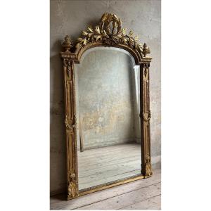 Glace de cheminée en bois sculpté et doré, réalisée dans le style Louis-Philippe XIXe siècle