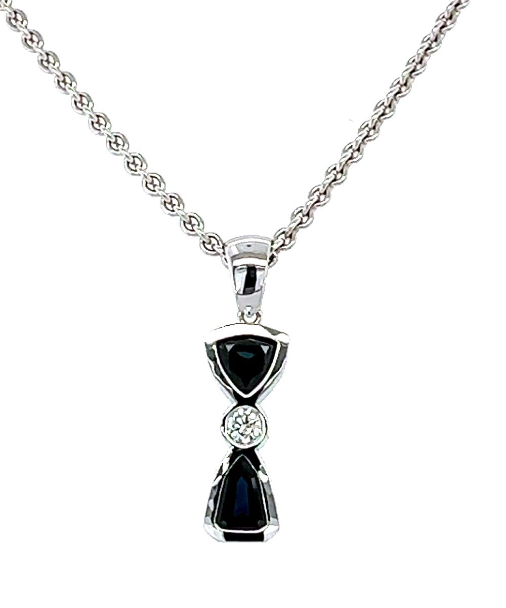 "18kt White Gold Pendant. With Sapphires And Diamond."