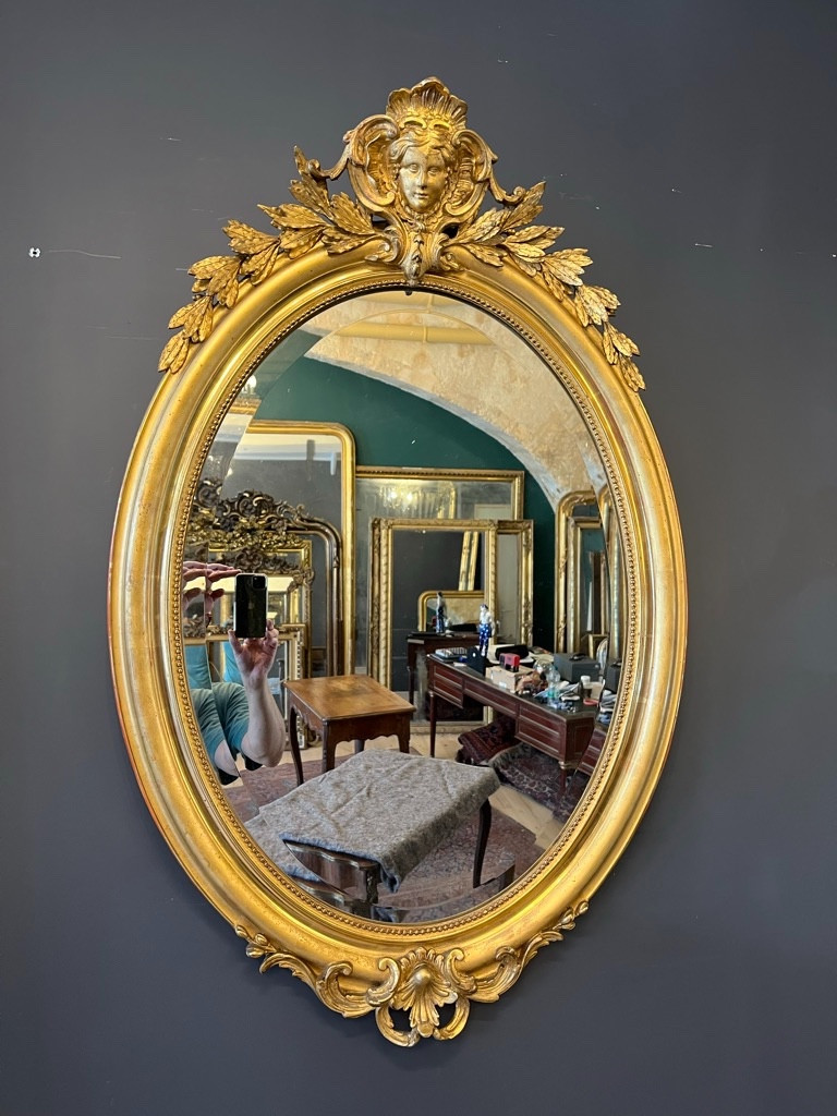 Miroir ovale 1900 au mascaron 107 X 70 CM