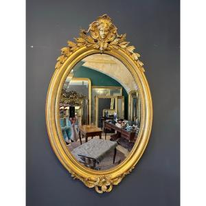 Miroir ovale 1900 au mascaron 107 X 70 CM