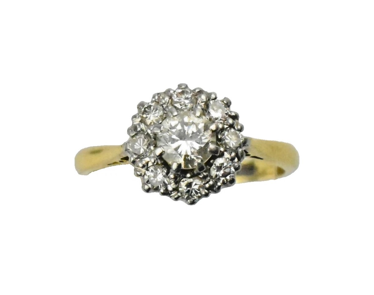 Bague marguerite vintage en or jaune, sertie d'un diamant rond taille brillant.