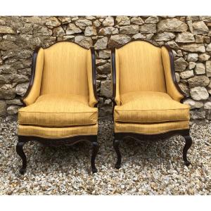 Paire de bergères à oreilles style Louis XV en noyer