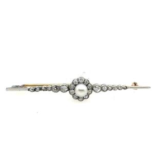 Broche antique en diamant et perle montée sur platine et or jaune 12 carats