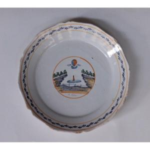 Earthenware Plate From Nevers Called "at The Tuileries", 18th Century.