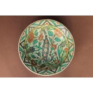 Iznik Siliceous Ceramic Dish Decorated With A Saz Palm, Tulips And Carnations. Seventeenth Century.